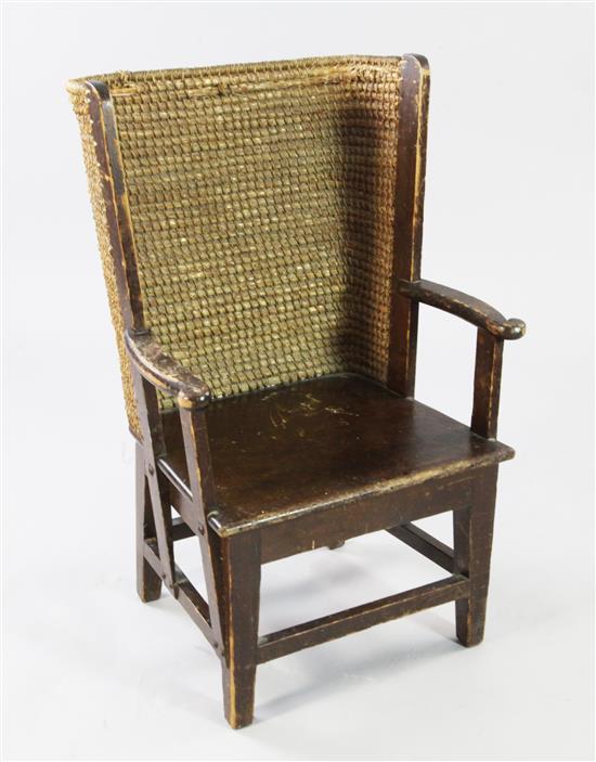 A small Liberty & Co stained pine and woven straw Orkney chair,